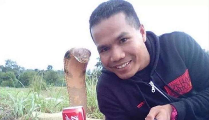 man with cobra