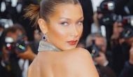 Bella Hadid posts nude beach photo on Instagram, with g-string and oversized straw hat