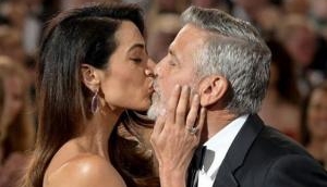 Amal Clooney planted a kiss on her man George Clooney at AFI Life Achievement Award  