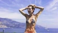 Bikini-clad actress Bella Thorne displays her armpit hair on the beach in Hawaii