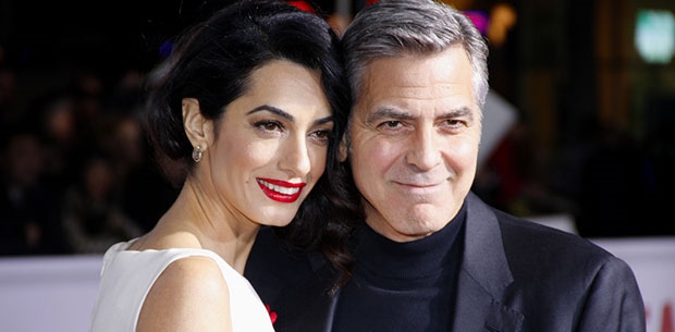George and Amal Clooney donate $100,000 to help migrant children 