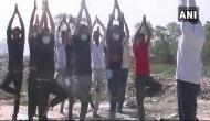 Locals in Uttrakhand perform yoga at trenching ground