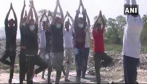 Locals in Uttrakhand perform yoga at trenching ground
