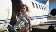 Rita Ora poses in sexy mini dress and boots as she travels by private jet