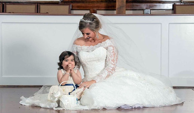 The 3-year-old cancer survivor becomes flower girl at bone marrow donor's wedding