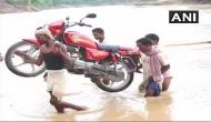 Jharkhand: In absence of bridge, villagers cross river on foot