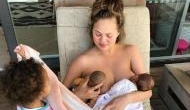 Chrissy Teigen shares topless photo of herself breastfeeding her son Miles and daughter Luna’s doll