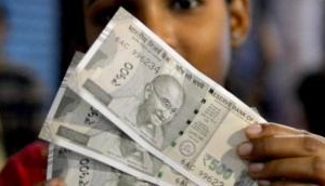 Rupee rises 14 paise to 70.90 against USD in early trade