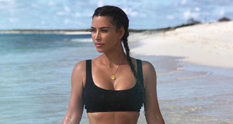 Kim Kardashian poses in sexy lingerie in bed before announcing Fendi campaign 