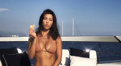 Kourtney Kardashian shares sexy bikini photo on a yacht in Italy 