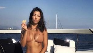 Kourtney Kardashian shares sexy bikini photo on a yacht in Italy 