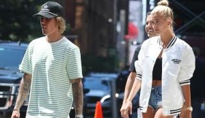 Hailey Baldwin flaunts her oval diamond engagement ring with Justin Bieber in NYC