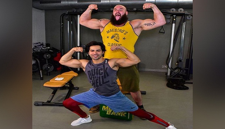 Varun Dhawan flexes with WWE Superstar Braun Strowman