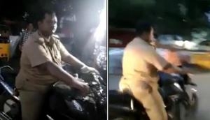 Drunken Coimbatore cop rides bike without helmet stopped by public; suspended after video goes viral