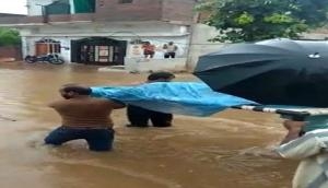 Madhya Pradesh: Pregnant woman carried on cot through flooded streets