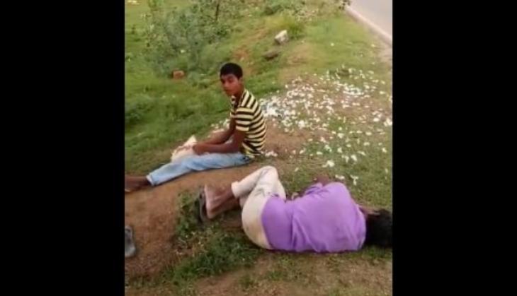 Watch Video: OMG! Drunk Telangana youth peals alive chicken's carcass and eat it, passerby filmed the act