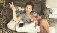 World Breastfeeding Week 2018: Jessie James Decker breastfeeds her son Forrest holding a glass of champagne