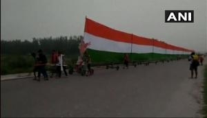 Uttar Pradesh: 35 Kanwar pilgrims carry 361-feet long tricolour