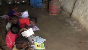 Chhattisgarh: Students in this Anganwadi study on wet floors