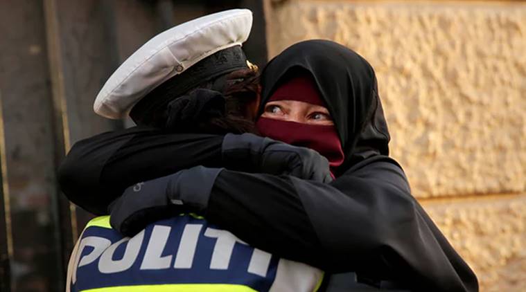 Viral Photo: Amidst Denmark’s face veil ban, see cop embracing woman in burka 