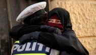 Viral Photo: Amidst Denmark’s face veil ban, see cop embracing woman in burka 