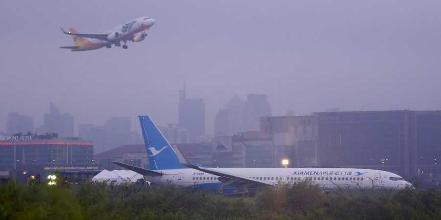 Plane from China skids off Manila runway amid downpour