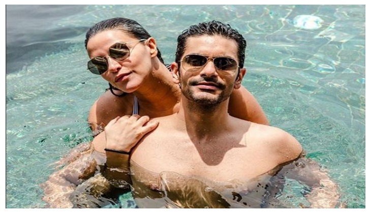 Neha Dhupia and Angad Bedi are expecting a child so save the date! Check out her baby bump picture with husband