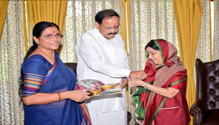 Raksha Bandhan: External Affairs Minister Sushma Swaraj ties rakhi to Vice President Venkaiah Naidu