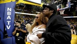 Fan rushes to stage at American singer couple Beyonce and Jay-Z's concert