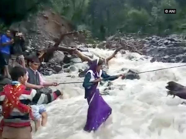Uttarakhand: Sans bridge, villagers use rope to cross river