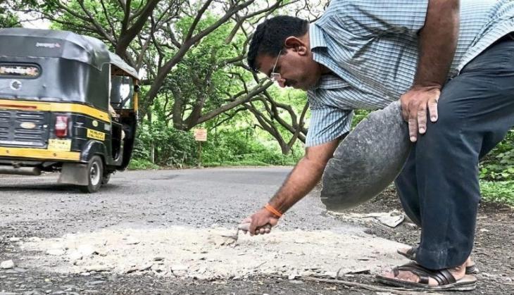 Mumbai Mai Fills Potholes