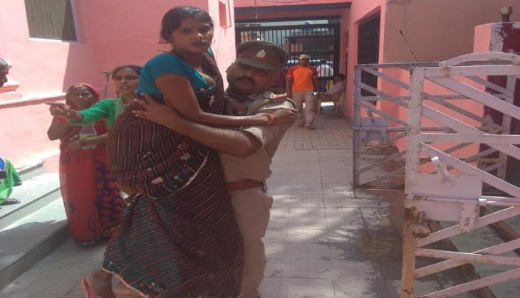 Mathura: Salute! Policemen carries pregnant woman in arms to help her reach hospital and wins heart