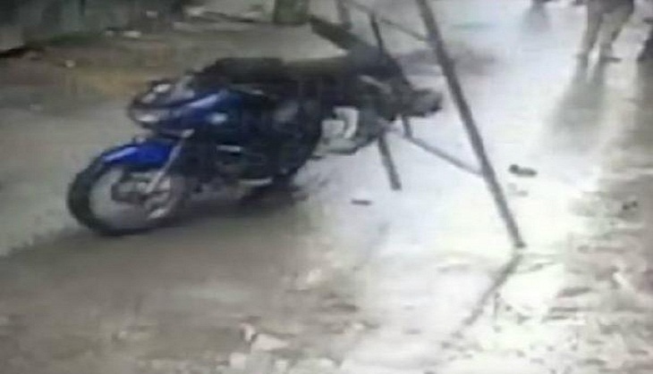 Bengaluru: CCTV footage captures how a biker escaped death as iron frame falls on him; see video