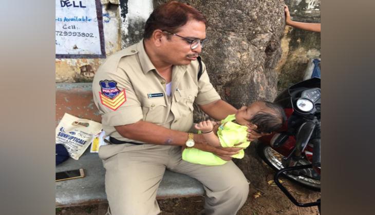 Heartwarming! Mother forced to bring her baby to the exam centre; Telangana cop babysits while she gives her exams