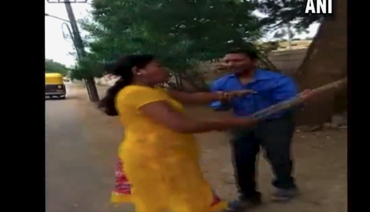 woman beats bank manager in public