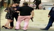 Caught on Camera: Man in pink pant identified as ex-BSP MP's son brandishes gun outside 5-star hotel in Delhi; booked