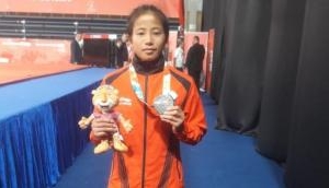 Youth Olympics silver medallist Thangjam Tababi Devi donates competition dress to IOC Museum