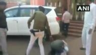 Watch: Farmer in Madhya Pradesh's Shivpuri cries, falls down on the feet of District Collector to fulfill his demand