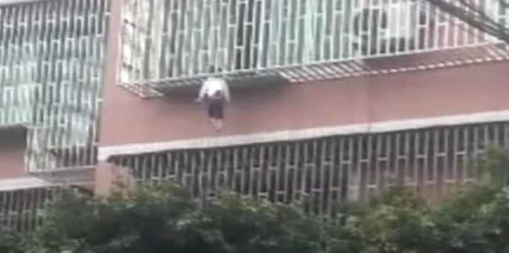 Scary Video: Girl trapped between railings by neck, dangles from third floor balcony and....!