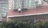 Scary Video: Girl trapped between railings by neck, dangles from third floor balcony and....!