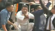 Watch: Rahul Gandhi, Priyanka & Jyotiradtiya sit down as dangling electrical wires interrupts rath; puts roadshow on halt