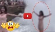 Watch this hair-raising video of a woman who swept away by gigantic wave while posing on a cliff