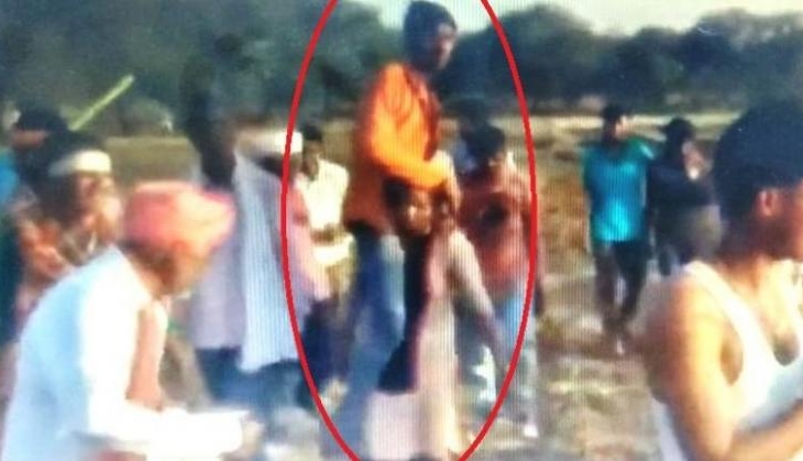 Woman forced to carry husband on shoulder as punishment for having affair w...