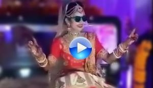 Amazing! Watch the swag of Indian bride who enters wedding venue by sitting on Jeep’s bonnet; here's the viral video