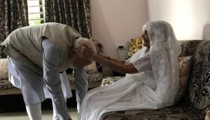 PM Narendra Modi seeks blessings of his mother before casting vote