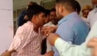Watch: BJP workers beat up poll officer in Moradabad as he allegedly asked voters to press 'cycle' button