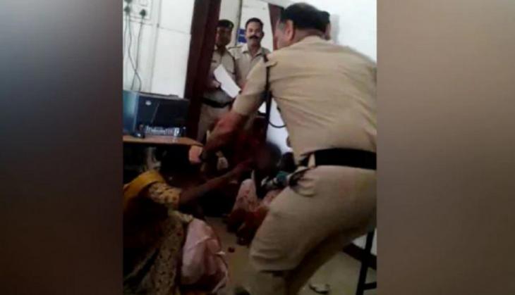 Madhya Pradesh: Cop caught on camera ruthlessly thrashing woman with child in Gwalior police station 