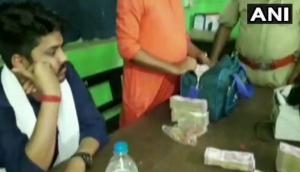 Two held in Asansol railway station with Rs.1cr cash, accused claims money sent by BJP