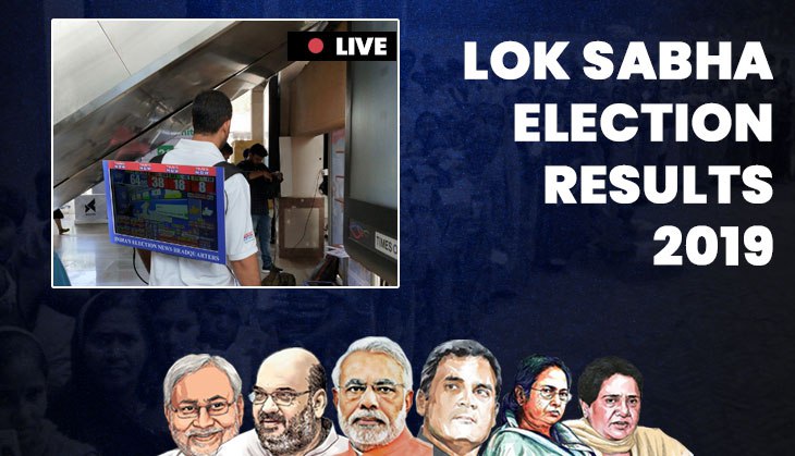Crazy guy! Watch how man carries LCD TV on his back, displaying LS election results at Metro station