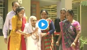 Watch how PM Modi’s mother greets BJP's supporters outside her house; see video